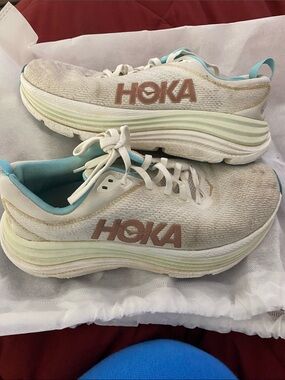 Hoka White Sneakers with Light Blue Trim and Tan Logo